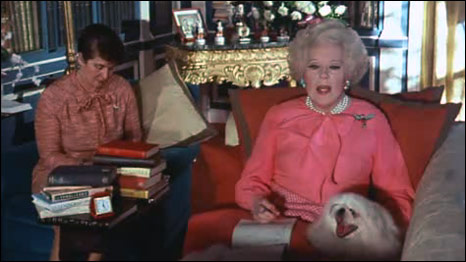 Barbara Cartland dictates a novel to her secretary